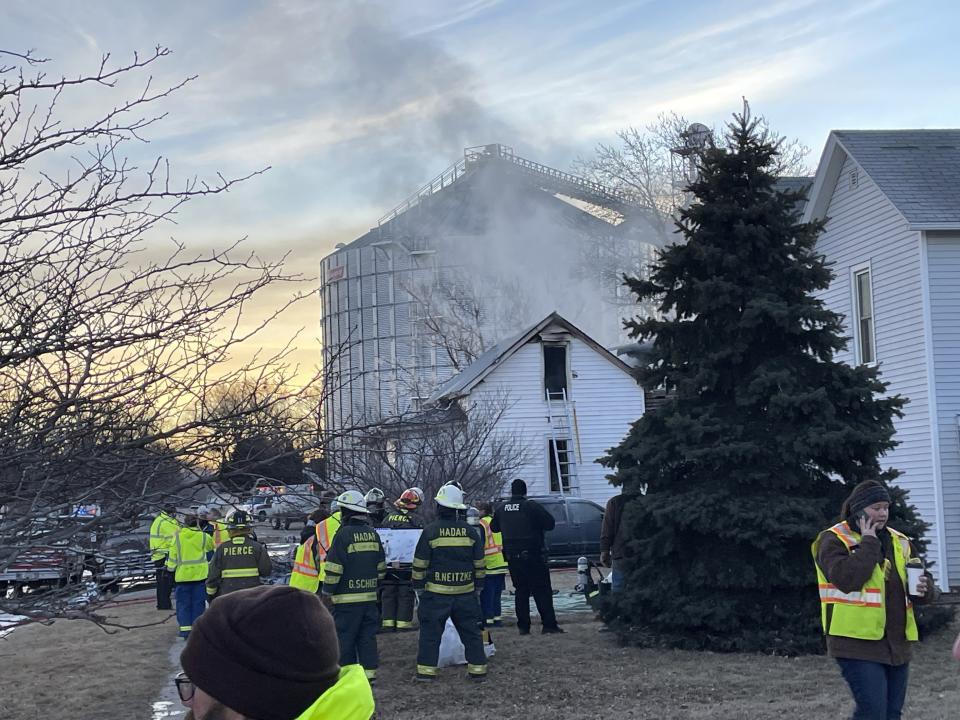 Multiple area fire departments assist Pierce Fire & Rescue at the scene of a house fire in Pierce, Neb., early Saturday morning, Jan. 29, 2022. Three children died after the home caught fire in a rural area of northern Nebraska. (Kathryn Harris/The Norfolk Daily News via AP)