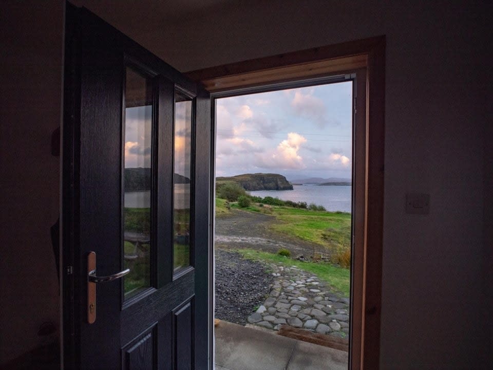 A look out the front door of an Airbnb on the Isle of Skye, showing the ocean