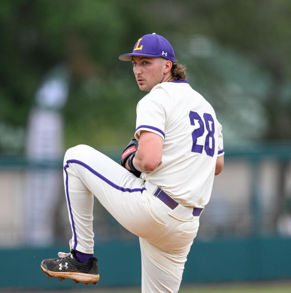 Lipscomb University's Ethan Smith prepares to throw 
a pitch toward home plate during the ASUN Championship baseball pool play between the Bison and Jacksonville May 26, 2023 at Melching Field in DeLand, Florida.