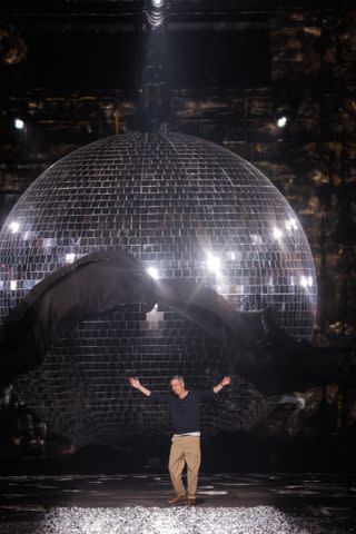 <p>Getty Images</p> Dries Van Noten takes a bow at his final show at Paris Fashion Week.