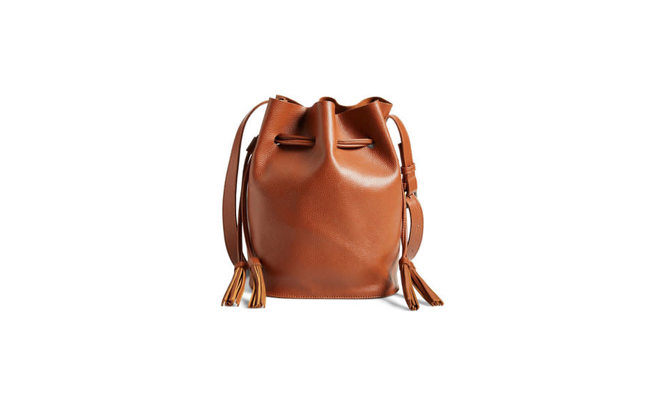 <p>This cognac-colored, casual take on the bucket bag is roomy and looks great with tunic dresses or jeans and a soft tee.</p><p>To buy: <a rel="nofollow noopener" href="http://click.linksynergy.com/fs-bin/click?id=93xLBvPhAeE&subid=0&offerid=446187.1&type=10&tmpid=8158&RD_PARM1=http%3A%2F%2Fshop.nordstrom.com%2Fs%2Fstreet-level-faux-leather-bucket-bag-online-only%2F3965949&u1=TL_crossbodybags" target="_blank" data-ylk="slk:nordstrom.com;elm:context_link;itc:0;sec:content-canvas" class="link ">nordstrom.com</a>, $48.</p>