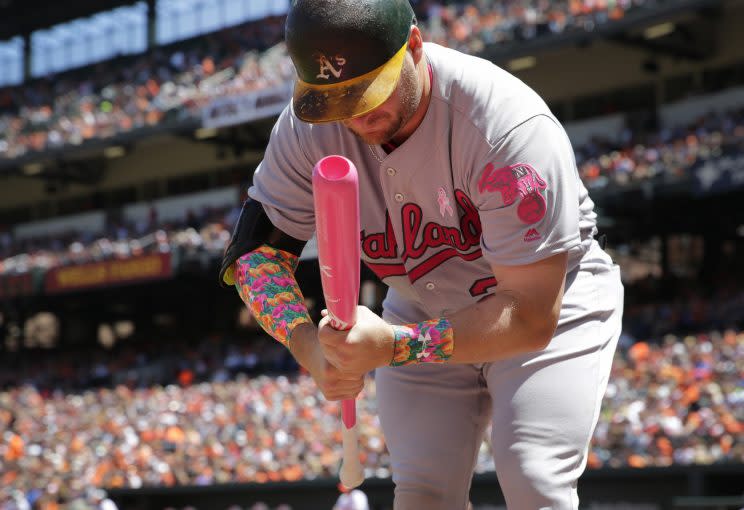 Stephen Vogt uses a cupped wooden bat. (AP Photo)