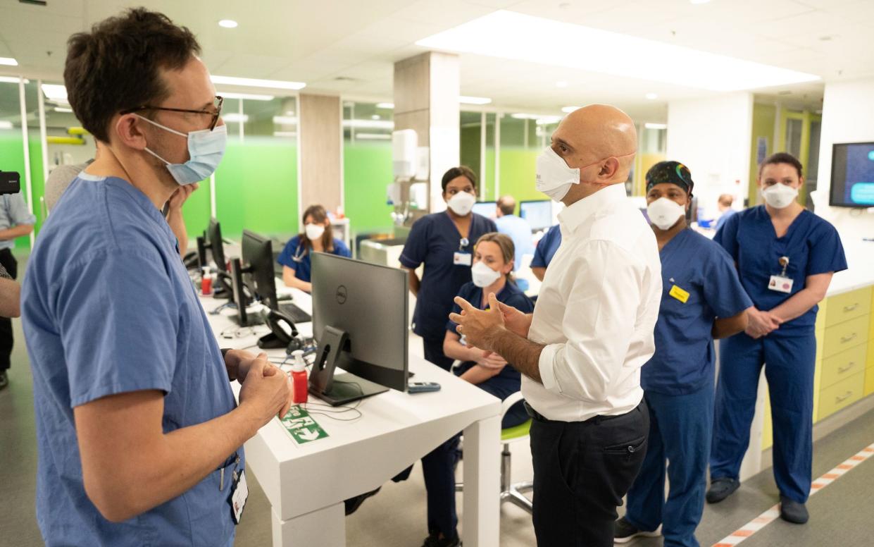 Health Secretary Sajid Javid talking to a consultant, Steve James, who has spoken about his refusal to be vaccinated despite working in intensive care since the start of the pandemic - Stefan Rousseau/PA Wire