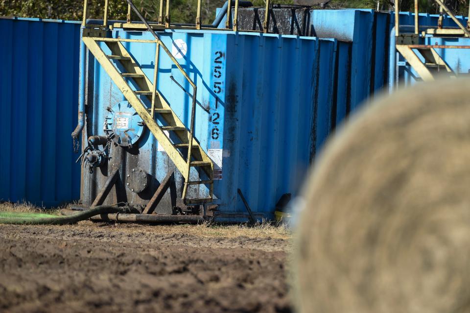 Tanks of soil amendment sit in a field in Jefferson County on Jan. 26, 2023. 