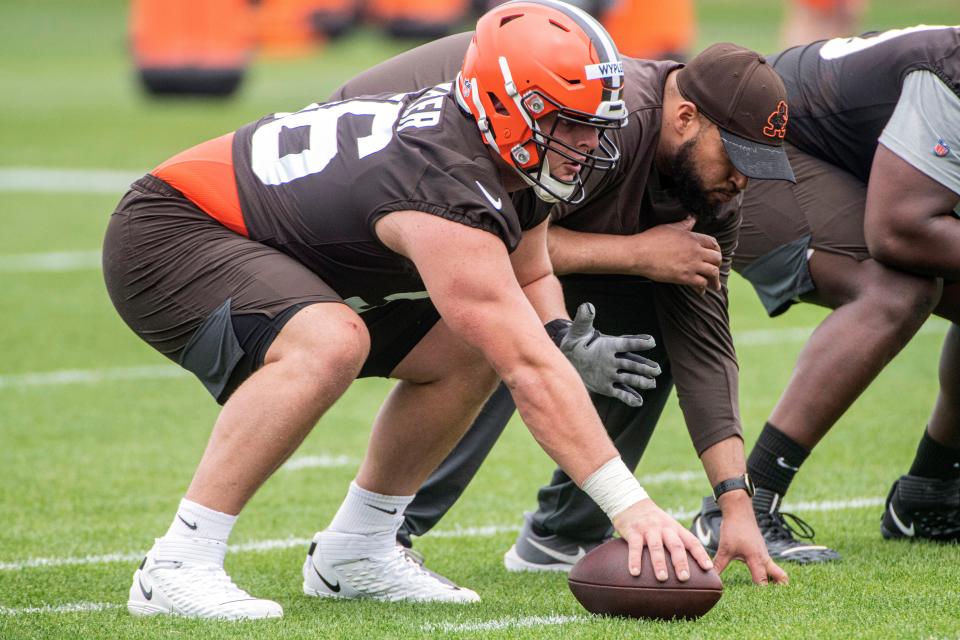 Browns rookie Luke Wypler, left, performs a drill at the team's rookie minicamp in Berea, Saturday, May 13, 2023.