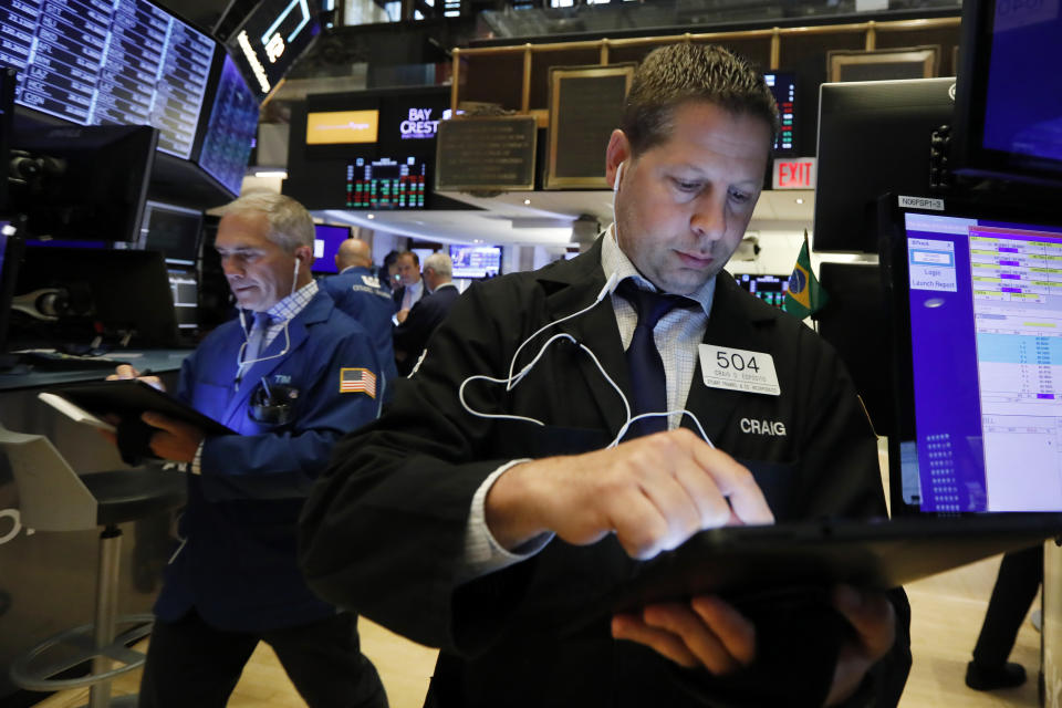 Trader Craig Esposito, right, works on the floor of the New York Stock Exchange, Thursday, May 30, 2019. Stocks are edging higher in early trading on Wall Street following two days of losses. (AP Photo/Richard Drew)