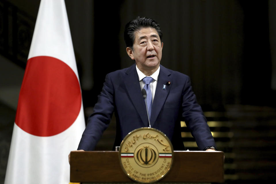 Japanese Prime Minister Shinzo Abe speaks with media during a joint press conference with Iranian President Hassan Rouhani, after their meeting at the Saadabad Palace in Tehran, Iran, Wednesday, June 12, 2019. The Japanese leader is in Tehran on an mission to calm tensions between the U.S. and Iran. (AP Photo/Ebrahim Noroozi)