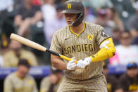 San Diego Padres' Ha-Seong Kim is called out on strikes while facing Colorado Rockies relief pitcher Nick Mears in the seventh inning of a baseball game Thursday, April 25, 2024, in Denver. (AP Photo/David Zalubowski)