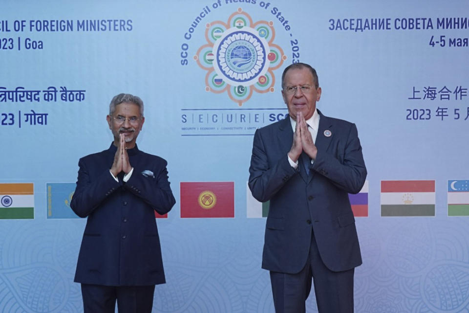 This photo released by Indian Foreign Ministry, Indian foreign minister S. Jaishankar, left, and his Russian counterpart Sergey Lavrov greet prior to the Shanghai Cooperation Organization (SCO) council of foreign ministers' meeting, in Goa, India, Friday, May 5, 2023. (Indian Foreign Ministry via AP)