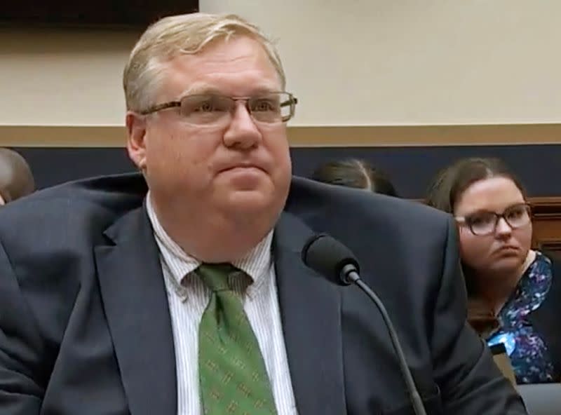 Lawyer J. Christian Adams speaks during a Capitol Hill hearing