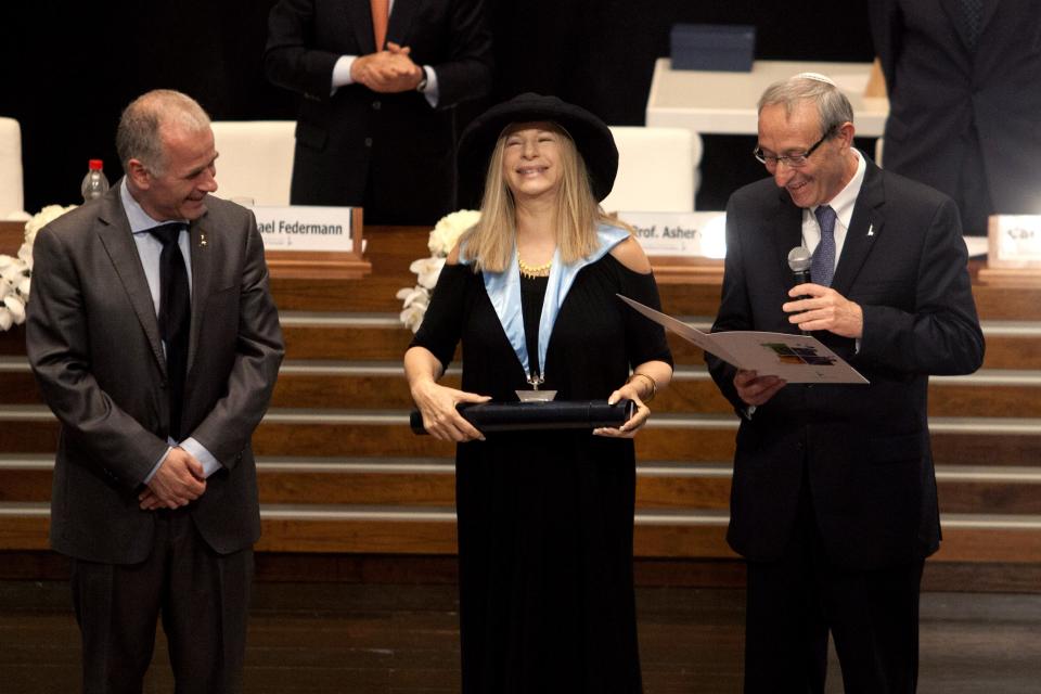 Entertainment star Barbra Streisand recives an honorary doctorate during a ceremony at the Hebrew University in Jerusalem, Monday, June 17, 2013. Streisand waded into one of Israel’s touchiest issues Monday on the first major stop of her tour of the country Jewish religious practices that separate men and women. (AP Photo/Dan Balilty)