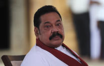 Sri Lanka’s former President Mahinda Rajapaksa, waits to be sworn in as the prime minister at Kelaniya Royal Buddhist temple in Colombo, Sri Lanka, Sunday, Aug. 9, 2020. (AP Photo/Eranga Jayawardena)