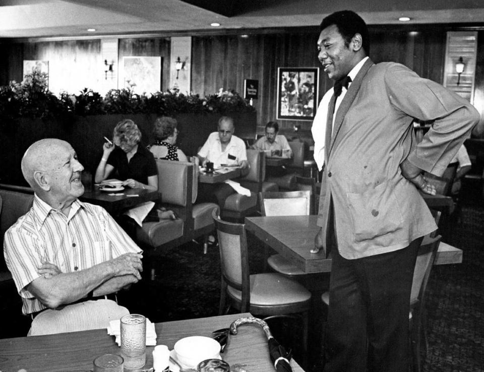 Customers chat with a server at Biscayne Cafeteria. Alan Freund/Miami Herald File