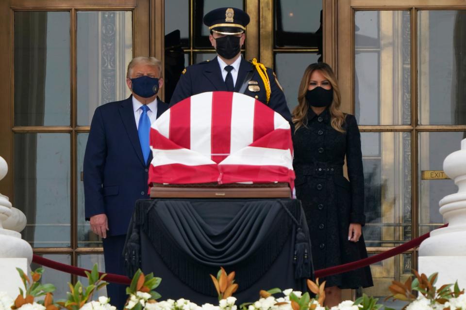 President Donald Trump and first lady Melania Trump pay respects as Justice Ruth Bader Ginsburg lies in repose at the Supreme Court building on Thursday, Sept. 24, 2020.