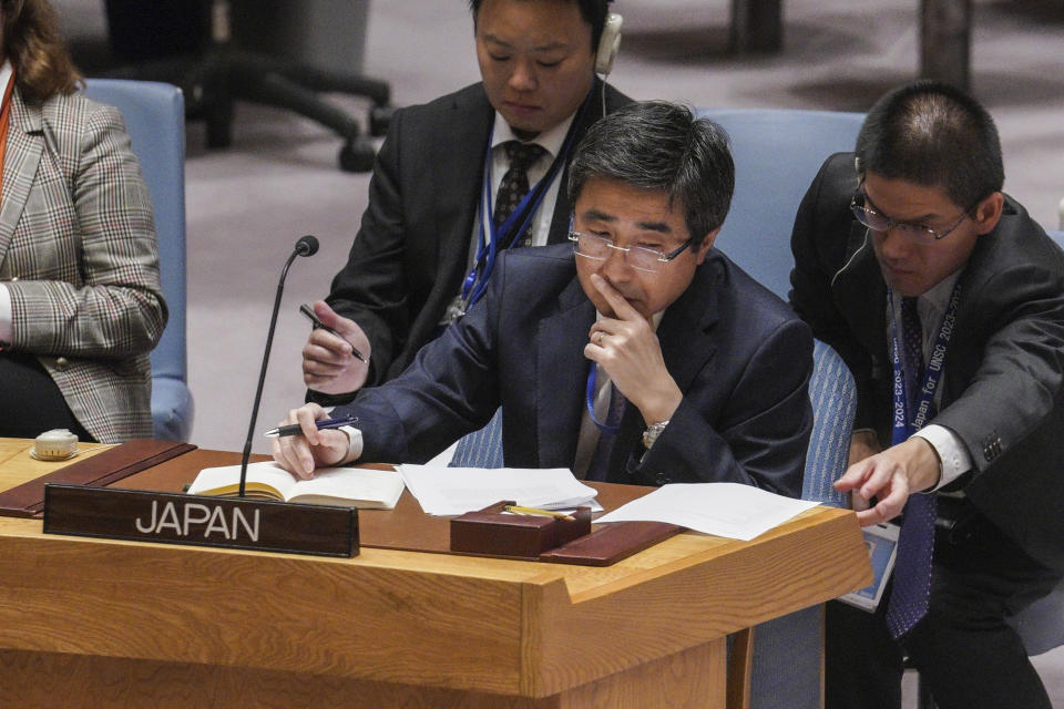 Japan's United Nations Ambassador Kimihiro Ishikane, left, confers with an aide, during the United Nations Security Council meeting to discuss a ballistic missile test by North Korea, Wednesday Oct. 5, 2022 at U.N. headquarters. (AP Photo/Bebeto Matthews)