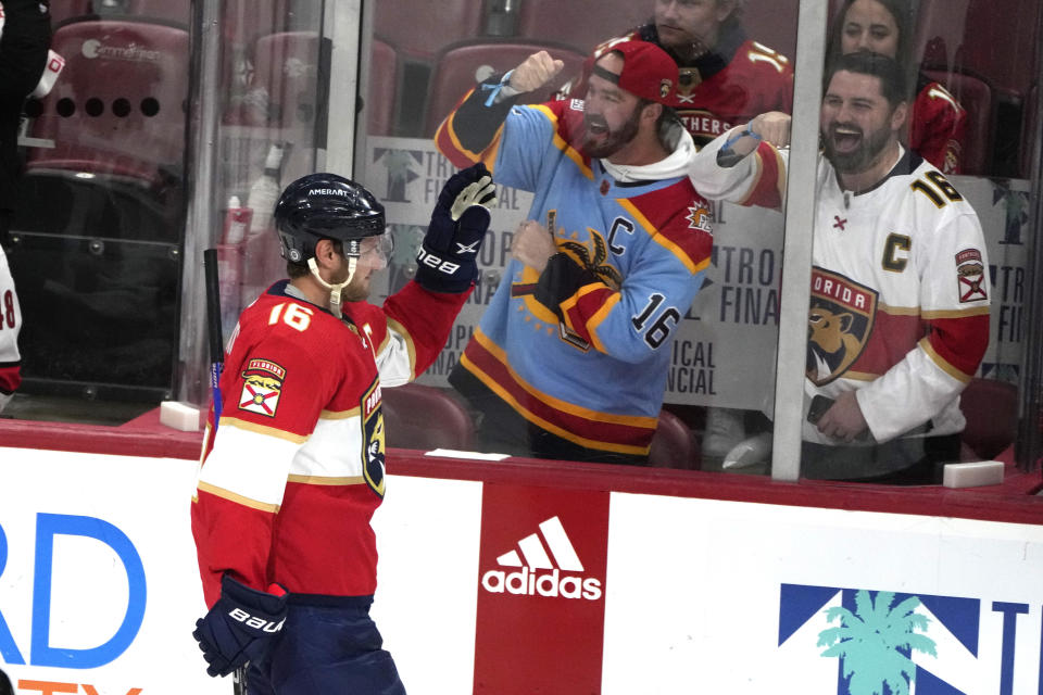 Fans cheer after Florida Panthers center Aleksander Barkov (16) scored a goal during the third period of an NHL hockey game against the Carolina Hurricanes, Thursday, April 13, 2023, in Sunrise, Fla. (AP Photo/Lynne Sladky)