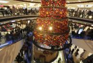 People walk through a shopping mall in Essen November 30, 2013. The busy Christmas shopping season traditionally begins on the first Advent weekend in Germany. REUTERS/Ina Fassbender