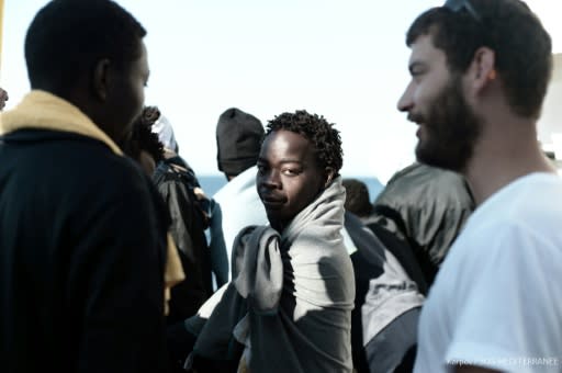 This handout picture from French non-governmental organisation Medecins Sans Frontieres shows migrants on board the MV Aquarius as it makes it way to Spain after being refused permission to dock in Italy