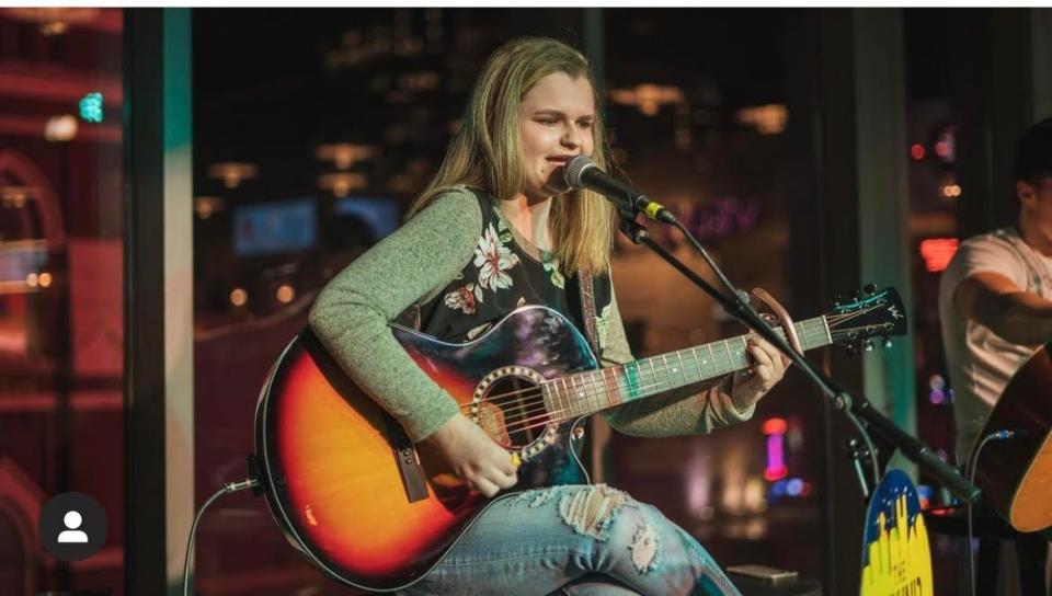 Sarah Hardwig plays an original song during the Round Downtown songwriters round in Nashville, Tennessee, in February 2022.