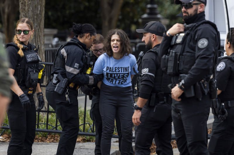 A protester against Israel's military actions in Gaza is arrested outside the White House in Washington, D.C., on Monday. The rally was led by Jewish groups who called for an immediate cease-fire as Israel responded to a deadly attack staged by Hamas on Oct. 7. Photo by Jim Lo Scalzo/UPI