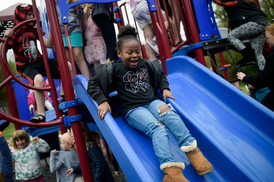 A student plays this spring on a new playground at Mount Olive Elementary School in South Knoxville. Members of the school community fundraised and received donations to build the new playground after a gap in funding from the school district.