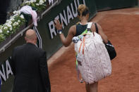 Japan's Naomi Osaka leaves after losing against Amanda Anisimova of the U.S. during their first round match at the French Open tennis tournament in Roland Garros stadium in Paris, France, Monday, May 23, 2022. (AP Photo/Christophe Ena)