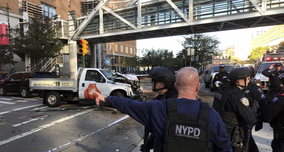 <p>New York City Police Officers respond to a report of gunfire along West Street near the pedestrian bridge at Stuyvesant High School in lower Manhattan in New York, Oct. 31, 2017. (Martin Speechley/NYPD via AP) </p>