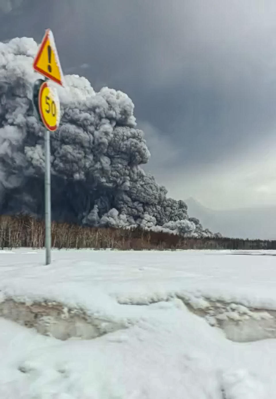 Smoke and ash are visible during the the Shiveluch volcano's eruption on the Kamchatka Peninsula in Russia, Tuesday, April 11, 2023. Shiveluch, one of Russia's most active volcanoes, erupted Tuesday, spewing clouds of ash 20 kilometers into the sky and covering broad areas with ash. (Alexander Ledyayev via AP)