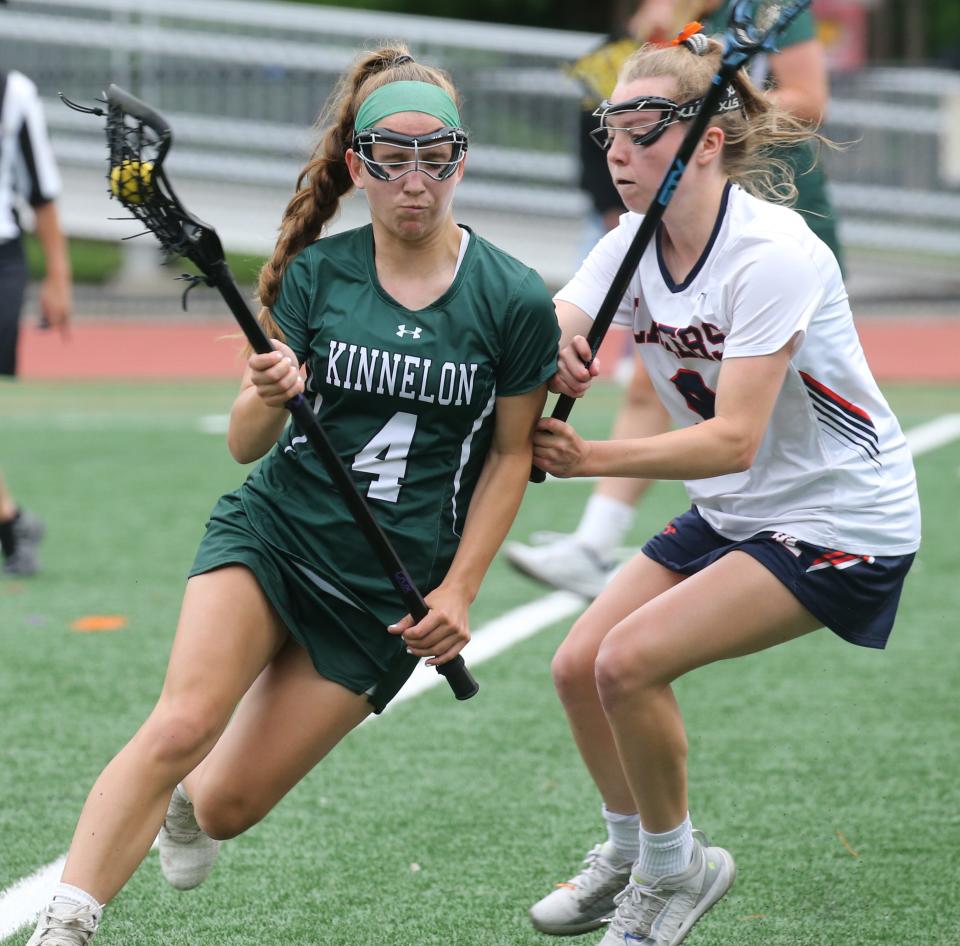 Melissa Elefonte of Kinnelon is geared by Lindsay Esposito of Mt. Lakes as Mountain Lakes defeated Kinnelon 16-5 in this girls lacrosse match played at Mountain Lakes on June 2, 2021.