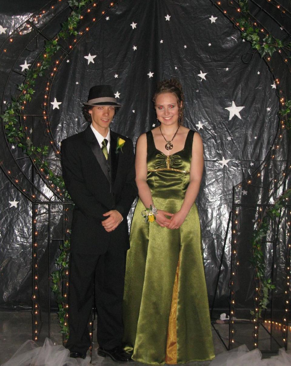 This May 2010 photo released by Karen Schwartz shows Arielle Roberts, right, and Jordan Tomlinson at the prom for Stanley Humphries Secondary School in Castlegar, British Columbia, Canada. Many prom couples want the boy's tie to perfectly match the girl's dres, and Jordan's mother made his green tie from fabric leftover from Arielle's dress. (AP Photo/Karen Schwartz)