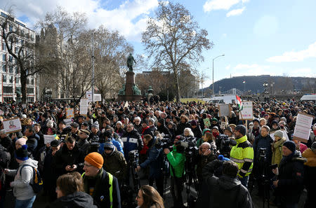 People gather outside the Hungarian Academy of Sciences to protest against government plans to weaken the institution in Budapest, Hungary, February 12, 2019. REUTERS/Tamas Kaszas