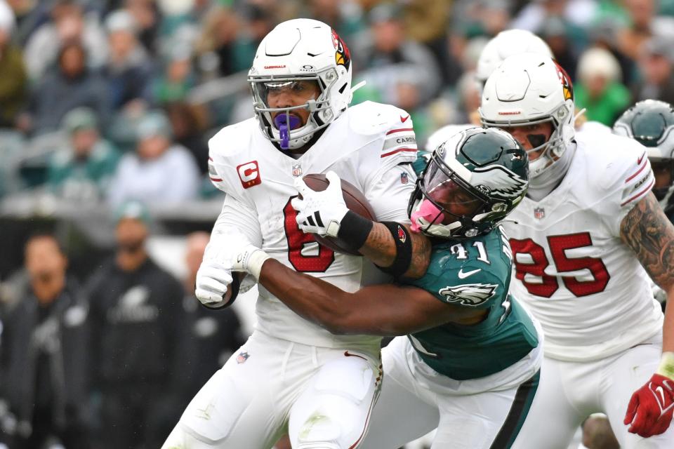 Arizona Cardinals running back James Conner (6) is tackled by Philadelphia Eagles linebacker Nicholas Morrow (41) during the second quarter at Lincoln Financial Field in Philadelphia on Dec. 31, 2023.