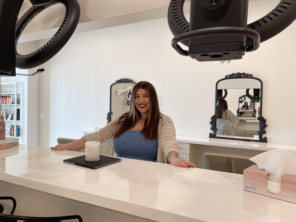 District 308 Salon & Boutique owner Ninalee Costelnock stands in her new Howell salon Monday, March 14, 2022.