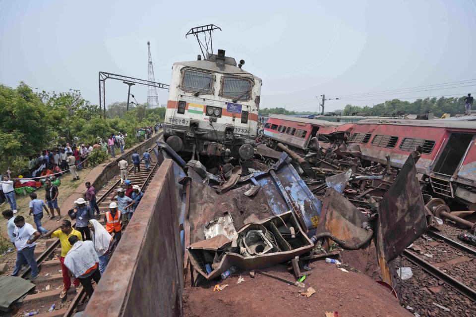 FILE - Rescuers work at the site of passenger trains that derailed in Balasore district, in the eastern Indian state of Orissa, Saturday, June 3, 2023. India’s federal crime agency Friday, July 7, 2023, said it has arrested three railway officials in connection with one of the country’s deadliest train accidents that killed more than 290 people people last month. (AP Photo/Rafiq Maqbool, File)