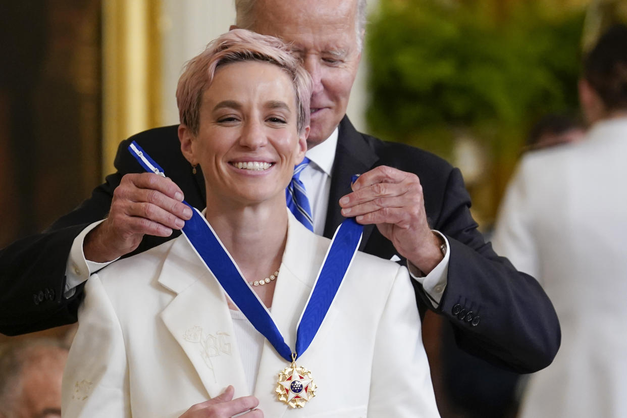 FILE - President Joe Biden awards the nation's highest civilian honor, the Presidential Medal of Freedom, to Megan Rapinoe at the White House in Washington, Thursday, July 7, 2022. On Sunday, Sept. 24, 2023, Rapinoe will play her final soccer game in a U.S. jersey when the United States faces South Africa at Chicago's Soldier Field. (AP Photo/J. Scott Applewhite, File)