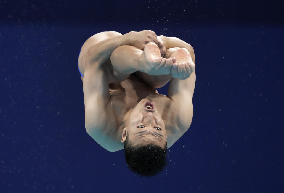 Ken Terauchi of Japan competes in men's diving 3m springboard preliminary at the Tokyo Aquatics Centre at the 2020 Summer Olympics, Monday, Aug. 2, 2021, in Tokyo, Japan. (AP Photo/Dmitri Lovetsky)