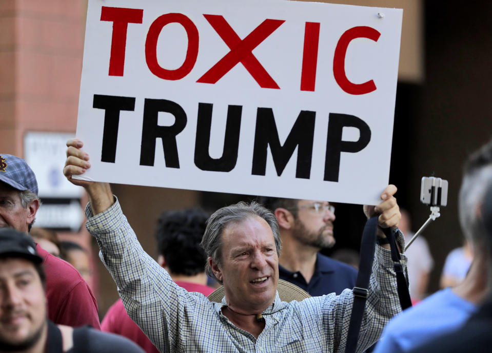 <p>People protest outside the Phoenix Convention Center, Tuesday, Aug. 22, 2017, in Phoenix. Protests were held against President Donald Trump as planned to host a rally inside the convention center. (AP Photo/Matt York) </p>