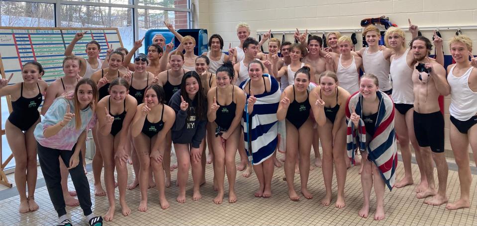 The Aurora High School swim teams celebrate the Suburban League championship following the victory over Copley.