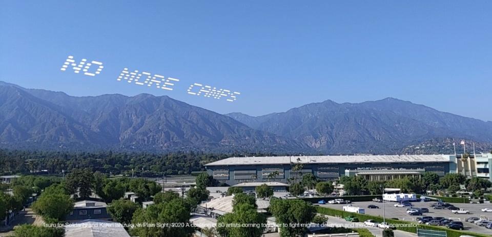 A mock up of the skytyped phrase "NO MORE CAMPS," chosen by artist Tsuru for Solidarity -- Karen Ishizuka. It will be seen over the Santa Anita Assembly Center during the In Plain Sight day of action over July 4 weekend in Los Angeles.  (Photo: Captured via the 4th Wall Augmented Reality App)