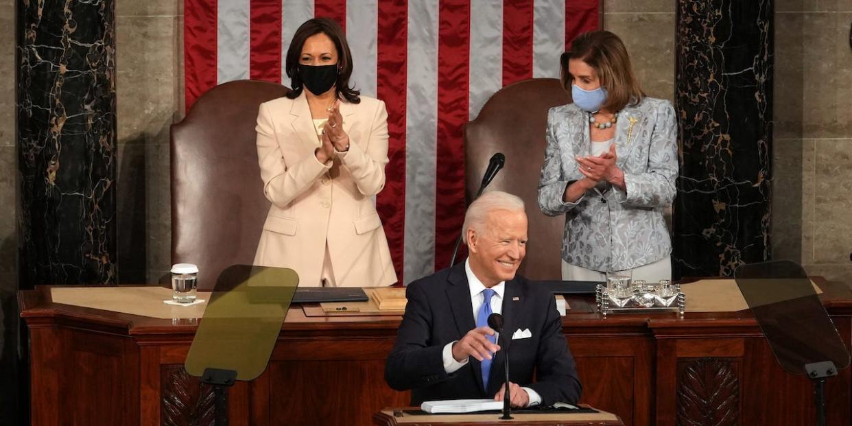 U.S. President Joe Biden addresses a joint session of Congress as Vice President Kamala Harris (L) and Speaker of the House U.S. Rep. Nancy Pelosi (D-CA) (R) look on in the House chamber of the U.S. Capitol.