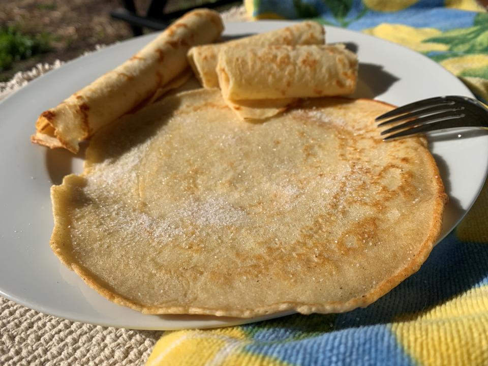 The traditional way to serve British pancakes is with a squeeze of lemon juice and a sprinkle of sugar.