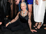 <p><a href="https://people.com/tag/helen-mirren/" rel="nofollow noopener" target="_blank" data-ylk="slk:Helen Mirren;elm:context_link;itc:0;sec:content-canvas" class="link ">Helen Mirren</a> makes herself comfortable at the Dec. 3 premiere of Paramount+'s series <i>1923</i>, where she and other guests sported retro attire for the Las Vegas event.</p>