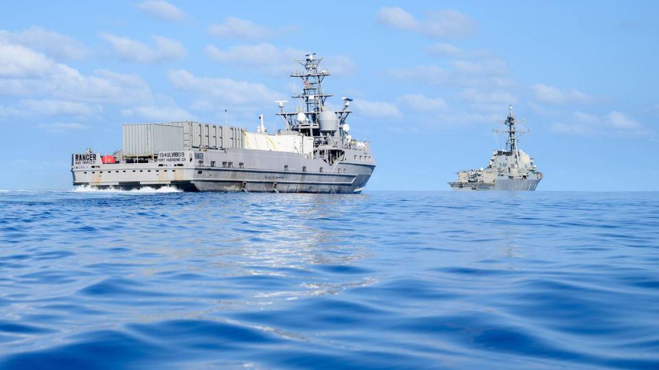 The unmanned surface vessel Ranger trails the Arleigh Burke-class destroyer Shoup during a September 2023 exercise to test test the integration of uncrewed platforms into fleet operations. (MC2 Jesse Monford/U.S. Navy)