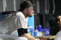 Colorado Rockies starting pitcher Kyle Freeland sits in the dugout after he was pulled from the mound during the fifth inning of the team's baseball game against the St. Louis Cardinals on Wednesday, Aug. 10, 2022, in Denver. (AP Photo/David Zalubowski)