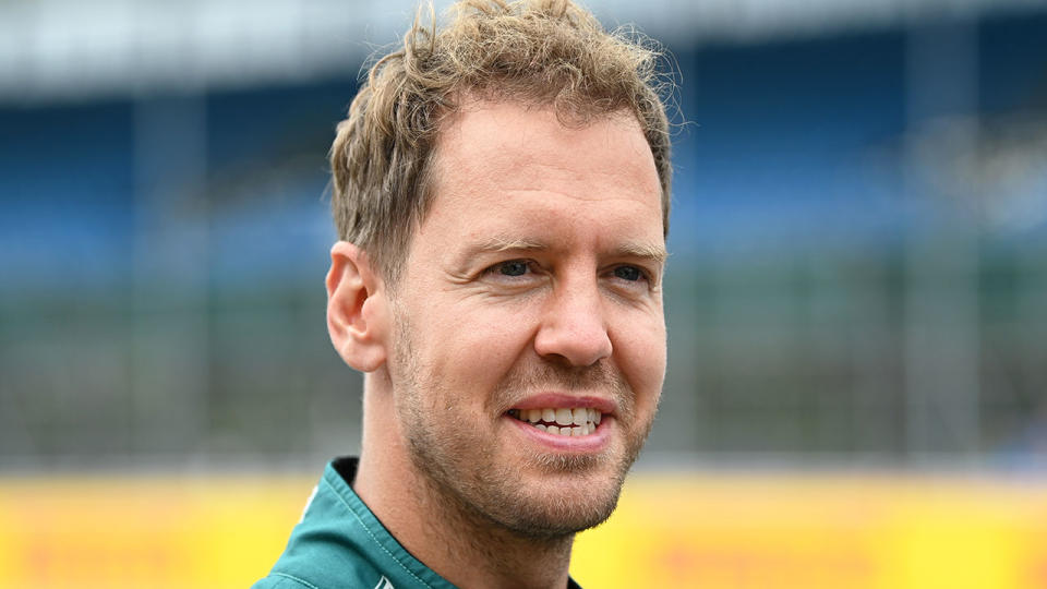 Pictured here, Aston Martin driver Sebastian Vettel gets ready for a race in 2021.