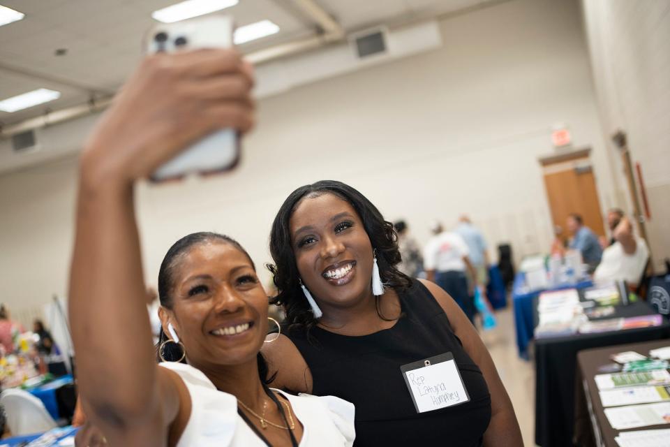 Jul 28, 2023; Columbus, Ohio, USA;   Angelik Smith, with the Minority Health Commission, takes a selfie with State Rep. Latyna Humphrey at a senior community resource fair.