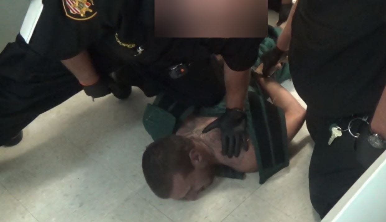 Alexander Rios, 28, of Wakeman, is seen being restrained by Richland County Jail corrections officers who wanted to place him in a restraint chair in this jail video taken Sept. 19, 2019. Rios lost consciousness and died eight days later in a local hospital.
(Photo: Screen shot from corrections' officers video)