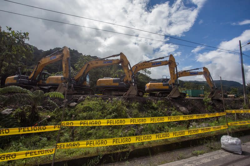 Excavators are parked near a damaged section of oil pipeline, about 25 km from the city of Tena in the Amazon