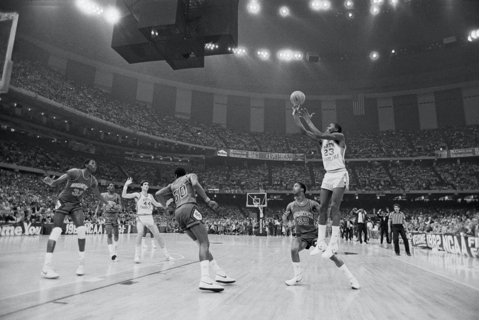 University of North Carolina basketball player Michael Jordan shoots the winning basket in the 1982 NCAA Finals against Georgetown University.<span class="copyright">Bettmann Archive/Getty</span>