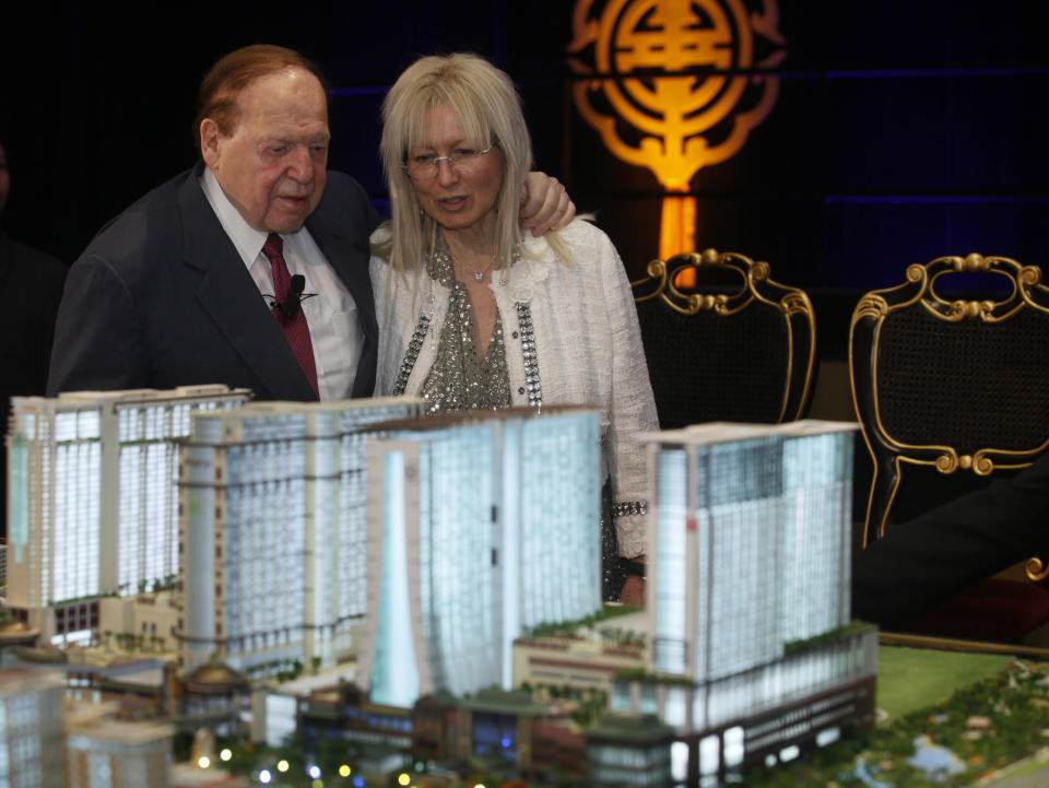 Las Vegas Sands Chairman and CEO Sheldon Adelson, right, and his wife Miriam Ochsorn stand in front of a model of the Sands Cotai Central during a news conference in Macau Wednesday, April 12, 2012. U.S. billionaire Adelson's Macau casino operator launched on Wednesday its long-delayed fourth resort, a $4.4-billion complex that's the company's latest bet on continued strong growth in the world's biggest gambling market. (AP Photo/Kin Cheung)